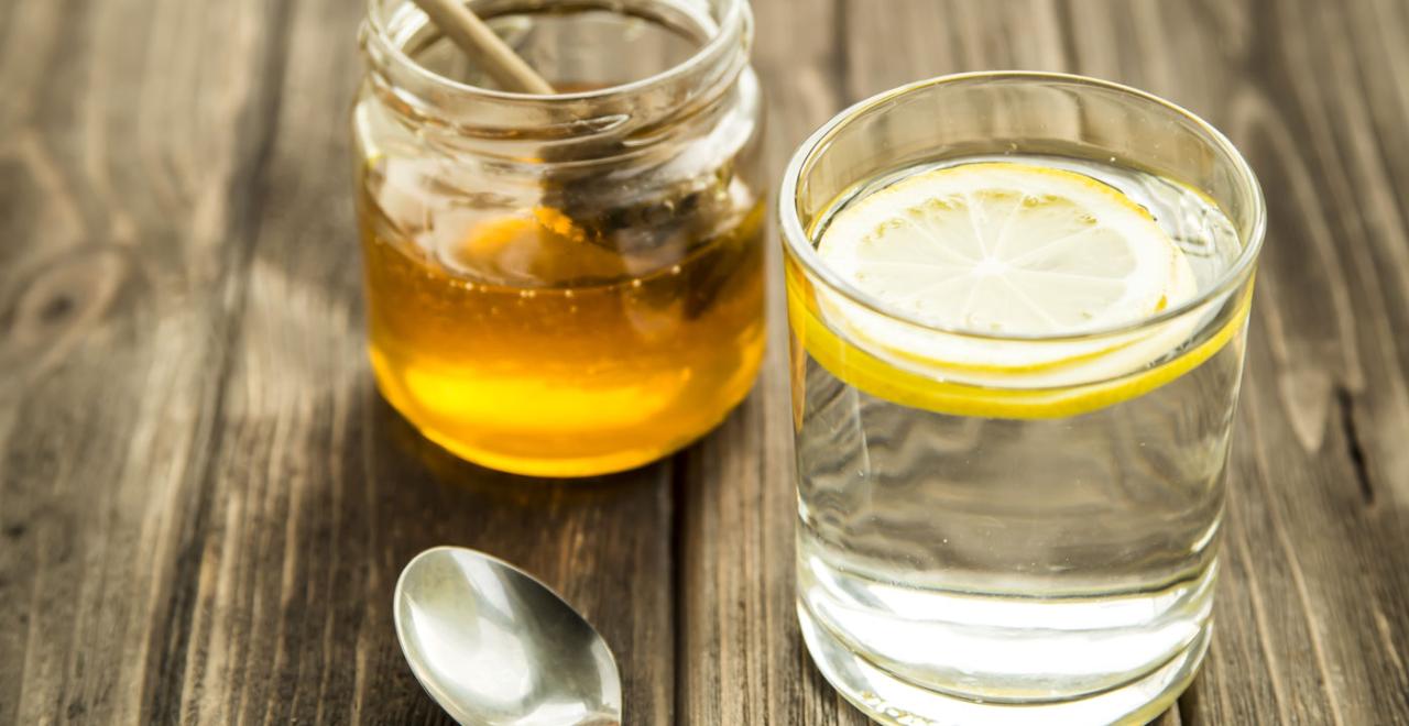 Lemon drink honey drinking benefits getty